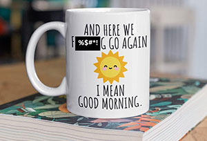 A coffee mug with a potty-mouth saying on it