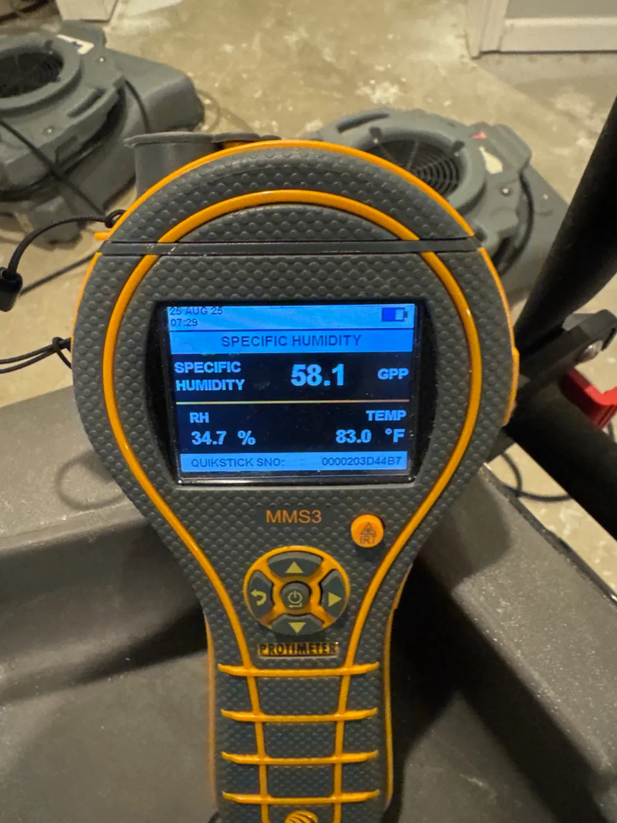 Moisture meter showing specific humidity 58.1 GPP, relative humidity 34.7%, and temperature 83.0°F.