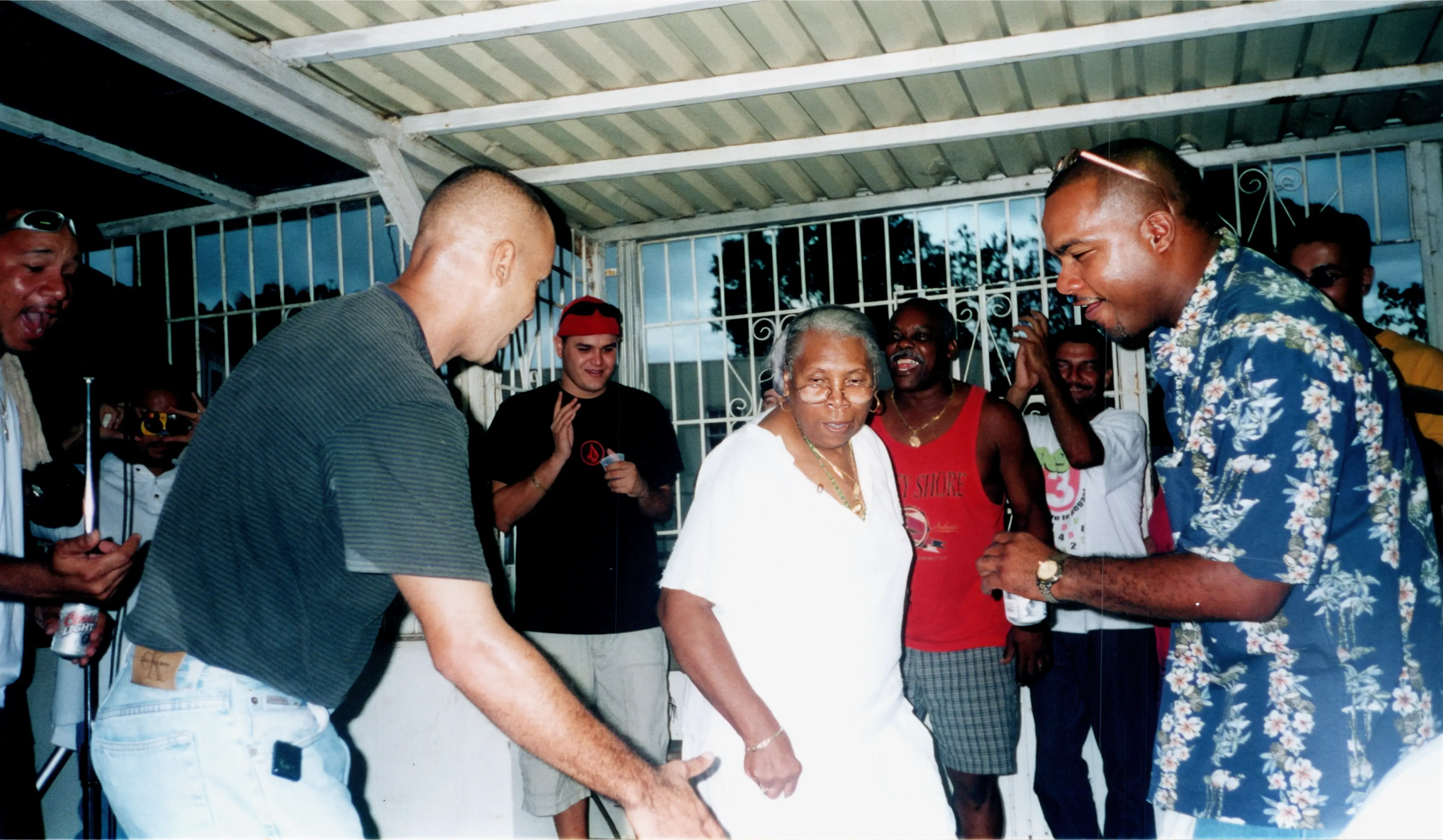 Compartir musical en la casa de Monin Guilbe ubicada en la “Calle de los Guilbe” en La Cuarta. En la foto Monin (QEPD) baila Bomba junto a Papote Alvarado y Luis “Kike”Rivera. Circa 2000.