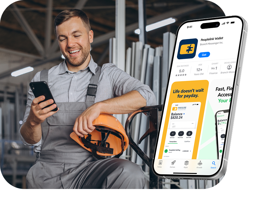 Smiling construction worker with a hard hat using a smartphone, with a phone screen showing a finance app.
