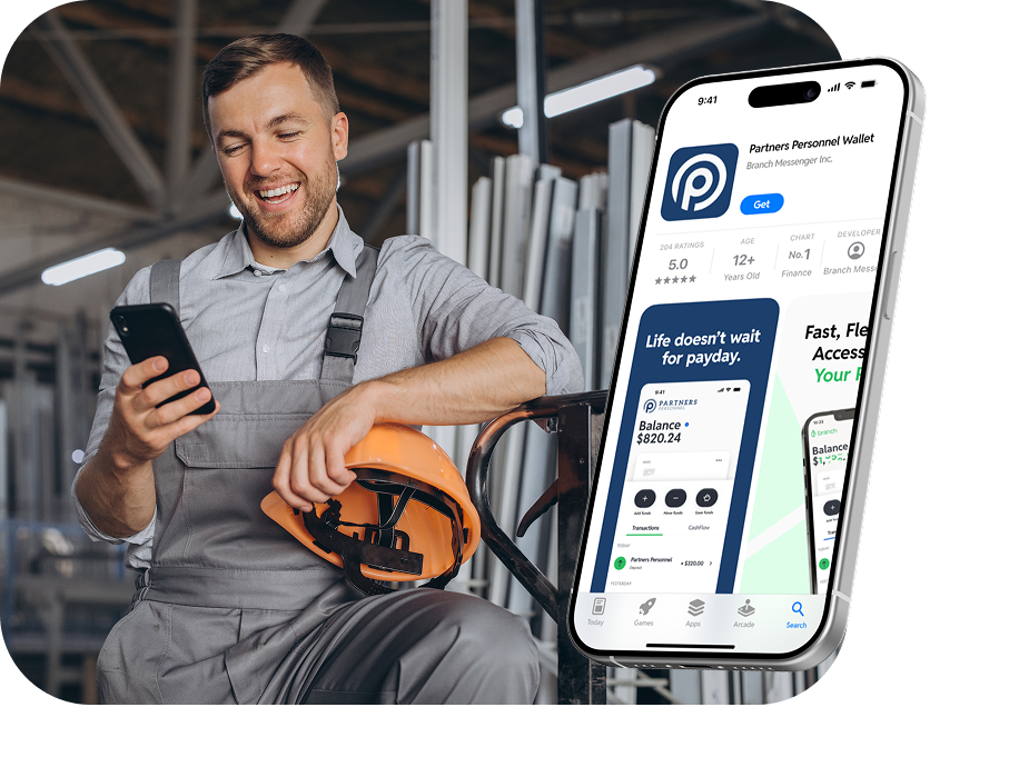 Smiling man in workwear holds phone and safety helmet with app screen overlay of payment app.