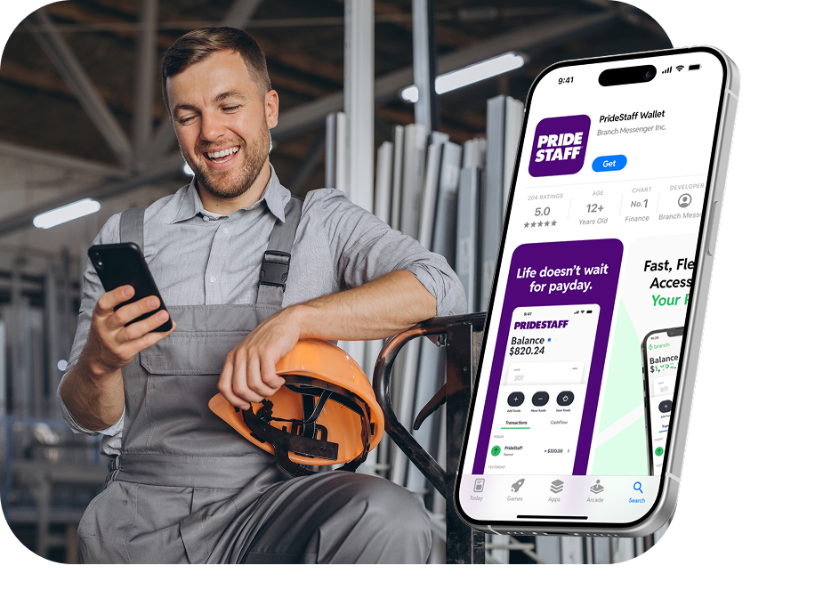 Smiling worker in gray overalls holding phone and orange helmet with app screen of PrideStaff Wallet shown.