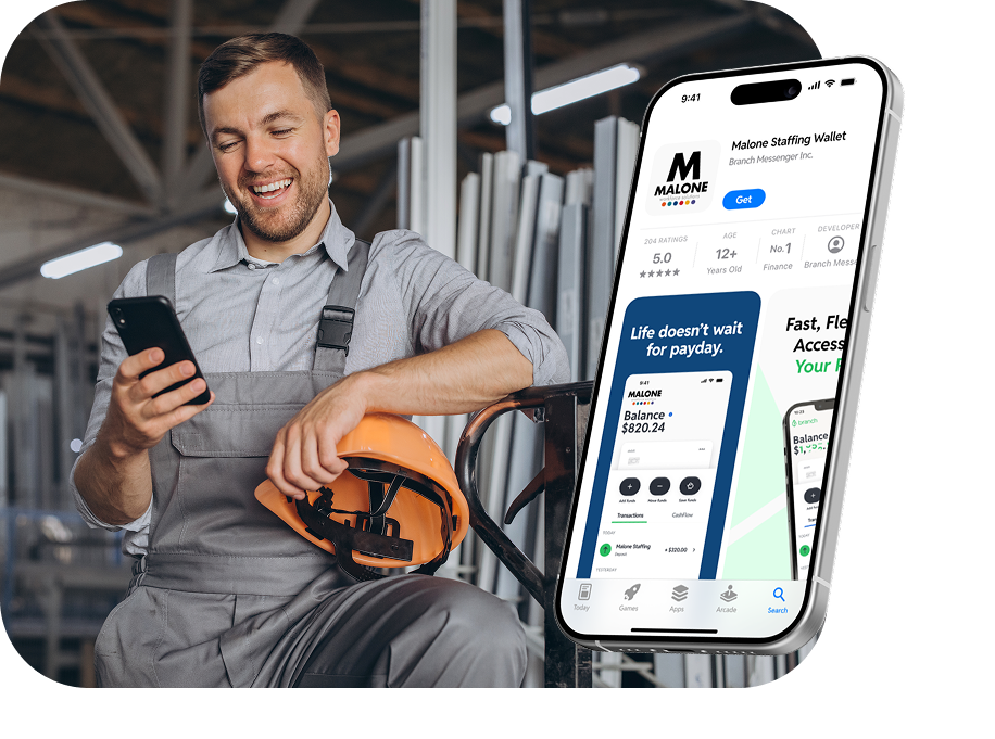 Smiling man in gray overalls holding phone and orange hard hat in industrial setting with phone app overlay.