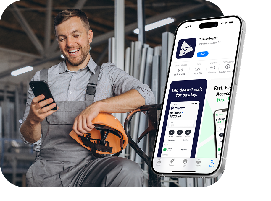 Smiling man in gray work overalls holding a phone and orange helmet, with a smartphone showing a finance app.