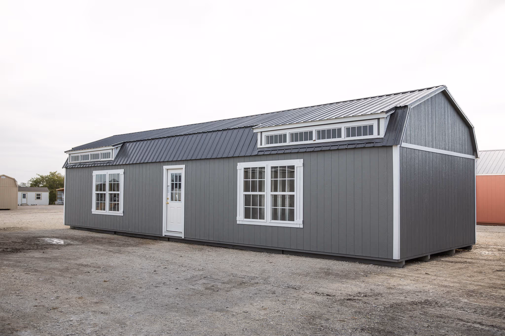 Cabin shell with the gambrel style roof, gives you higher ceiling and space for loft.