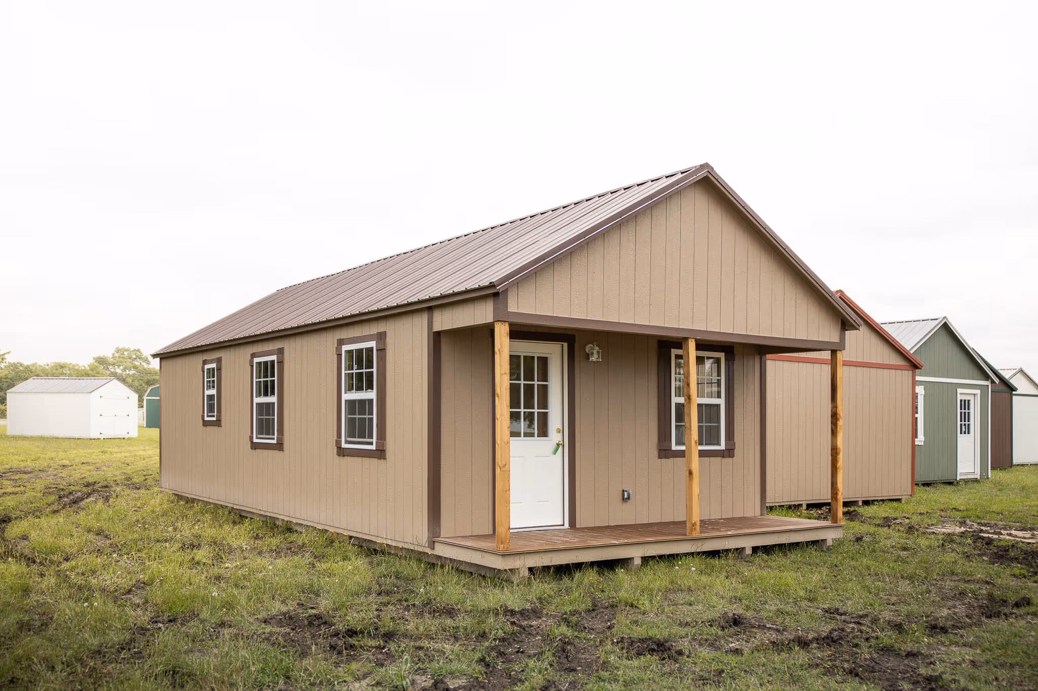 This style of cabin shell has an inset porch in one of the ends of the building. 