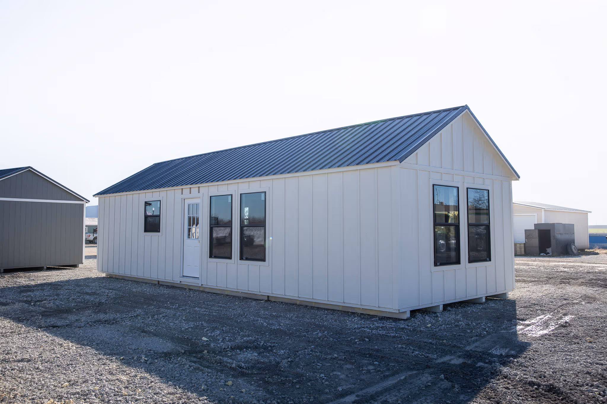 Cabin shell with board and batten siding giving it a modern farmhouse look.