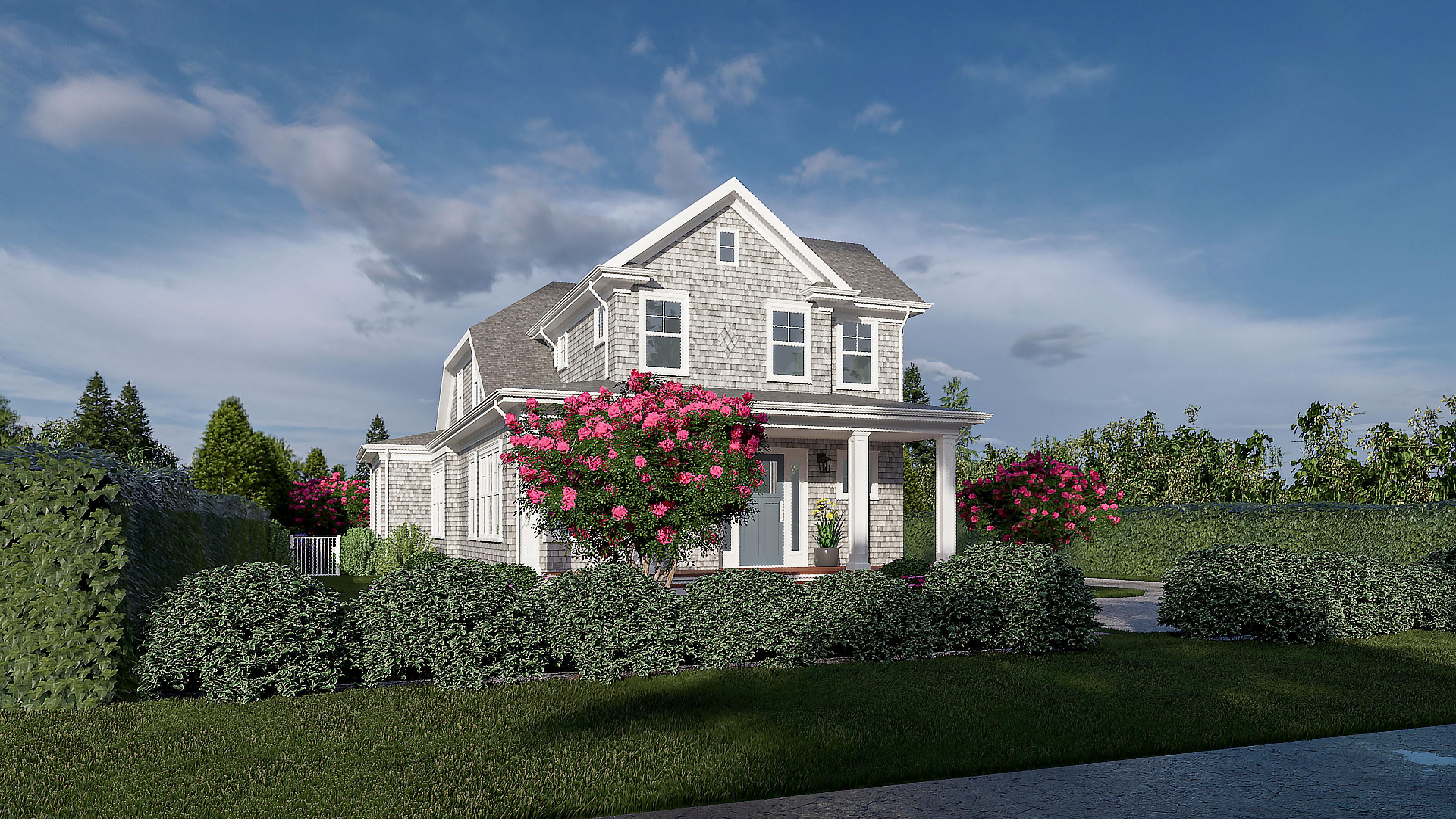 Two-story gray house with white trim, pink flowering bushes, green hedges, and blue sky above.