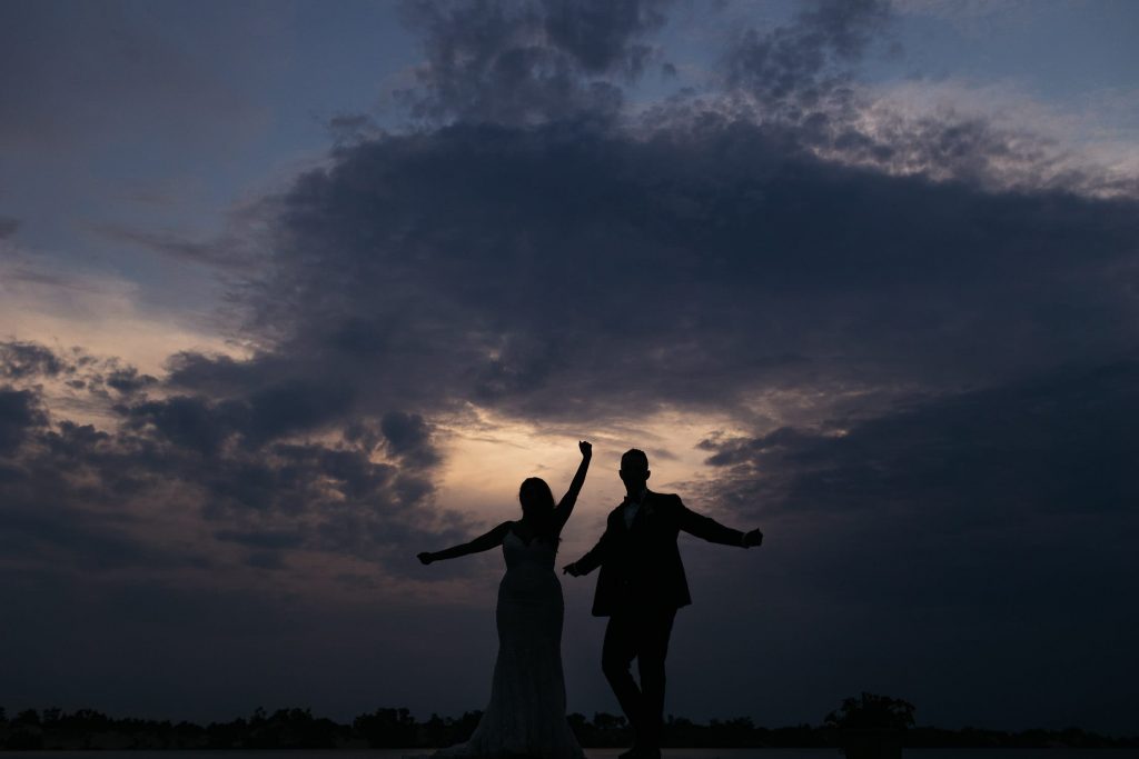 bride and groom dance at sunset in pec