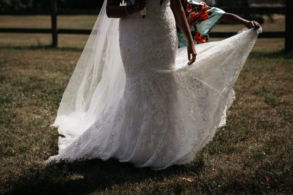 bride walking to first look at pec backyard wedding