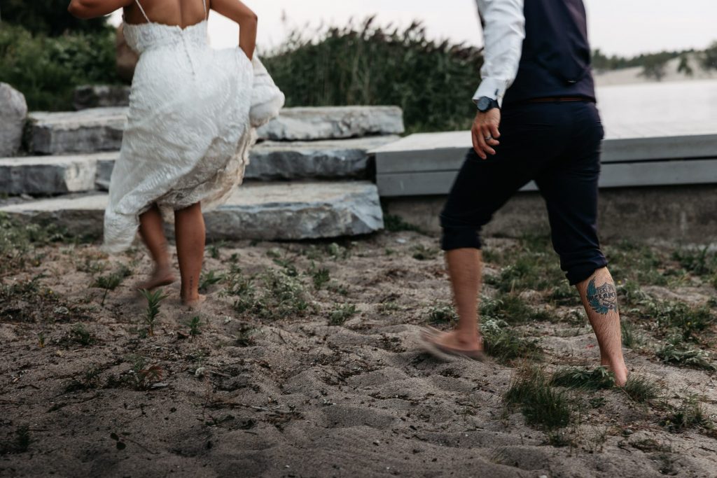 sandy feet of bride and groom after being in west lake pec