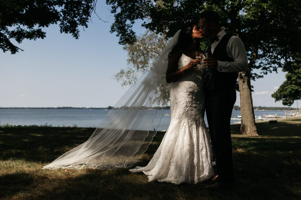 bride and groom kiss at prince edward county backyard wedding