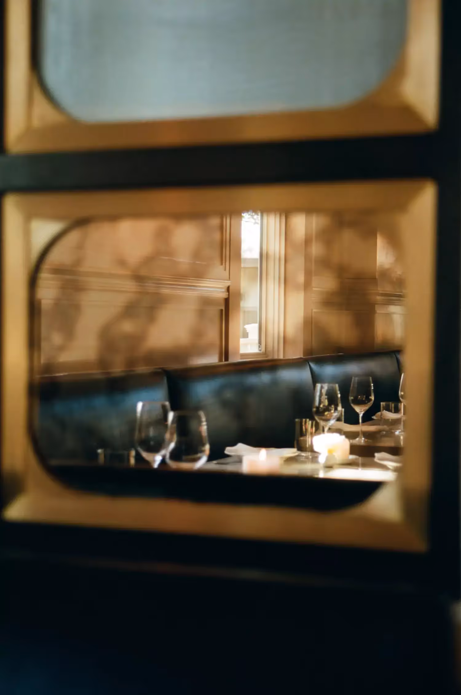 Inside dining room booth of Chez Noir