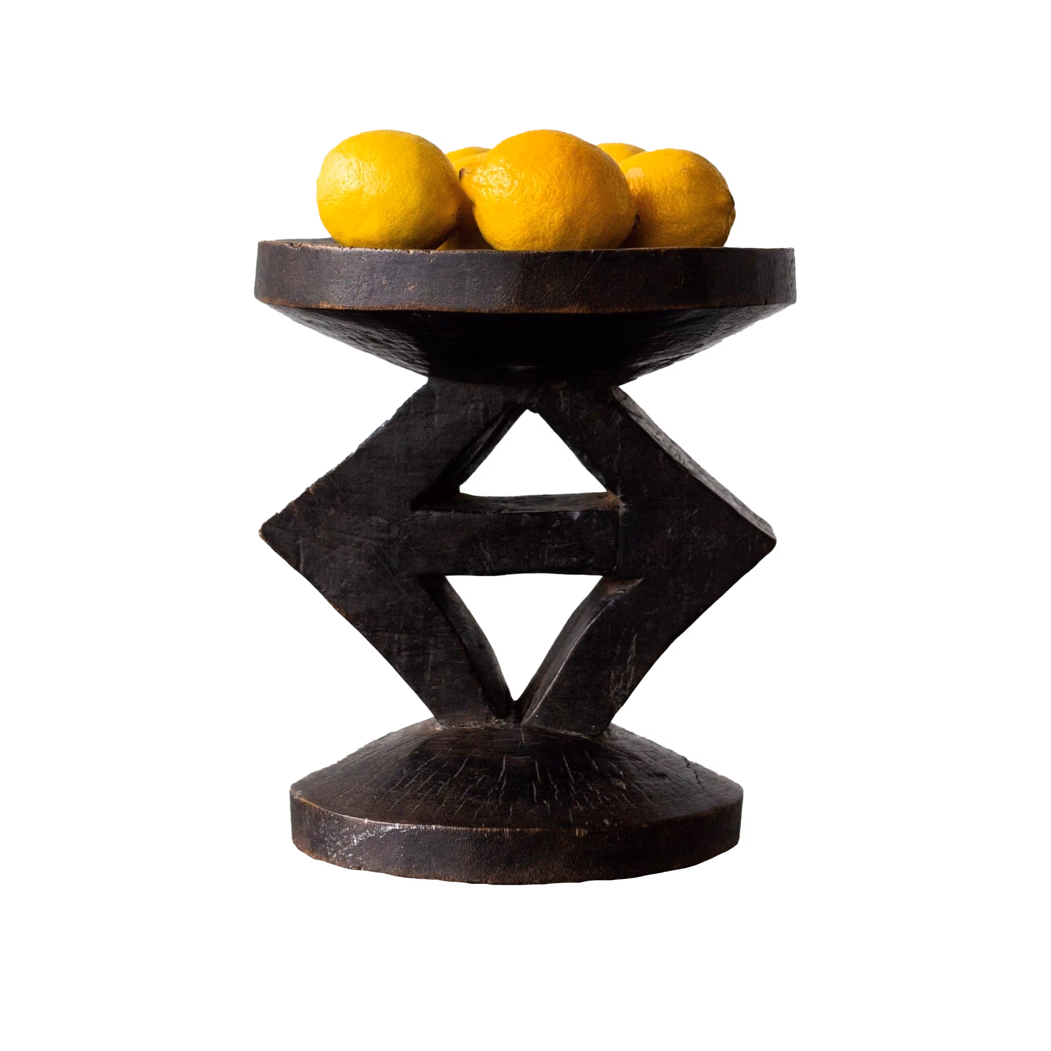 Carved wooden stool with lemons on top
