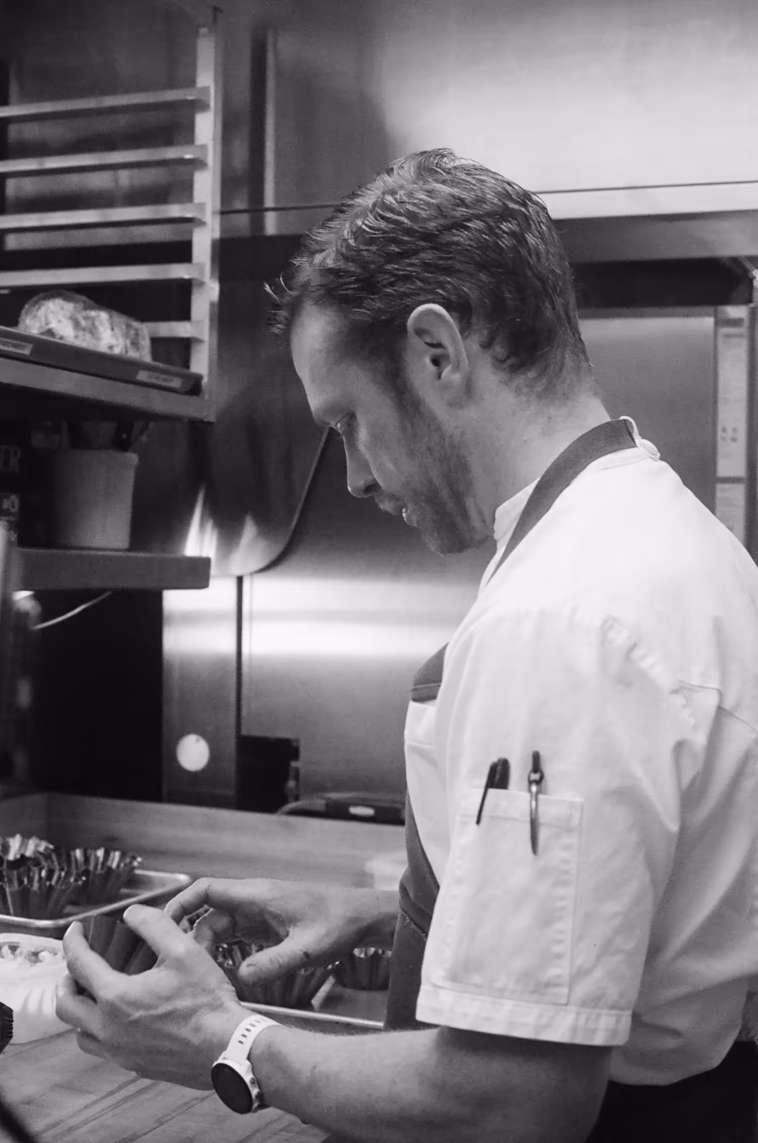 Chef Jonny Black working in the kitchen at Chez Noir