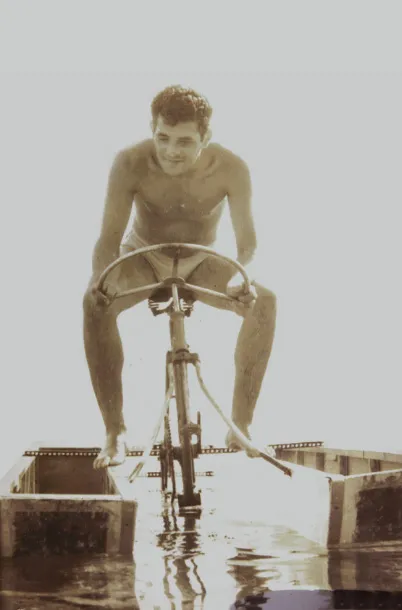 Fracraft vintage image of founder testing a experimental pedal propelled mini boat vessel.