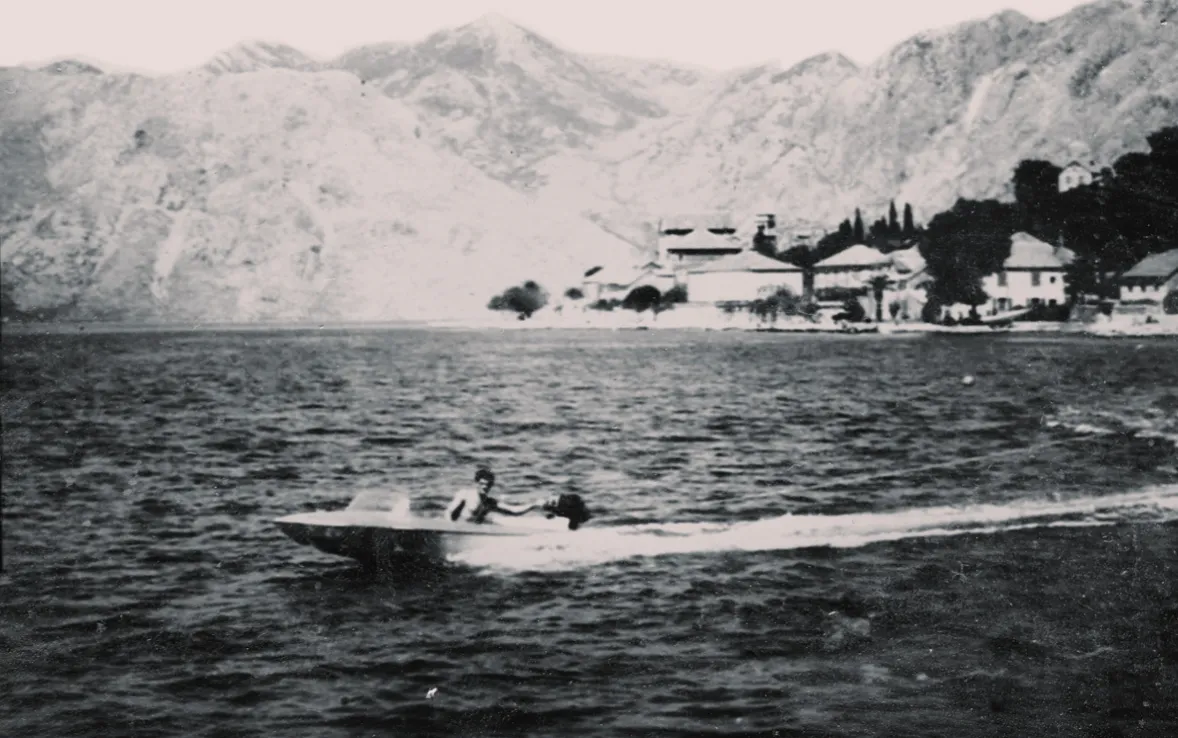 Old heritage image of boat cruising on Boka Kotorska bay.
