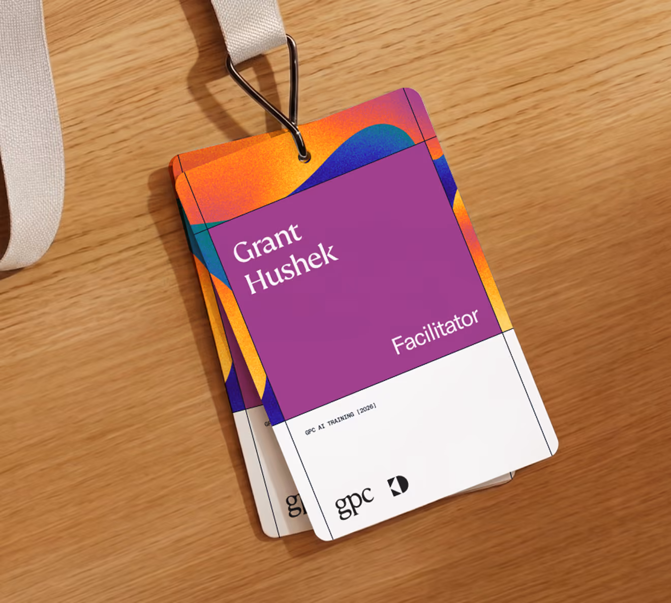 GPC facilitator lanyard badge on a wooden table