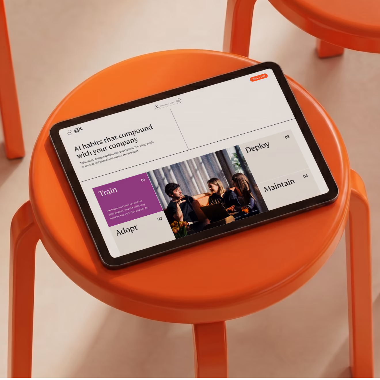 GPC site on a tablet resting on an orange stool