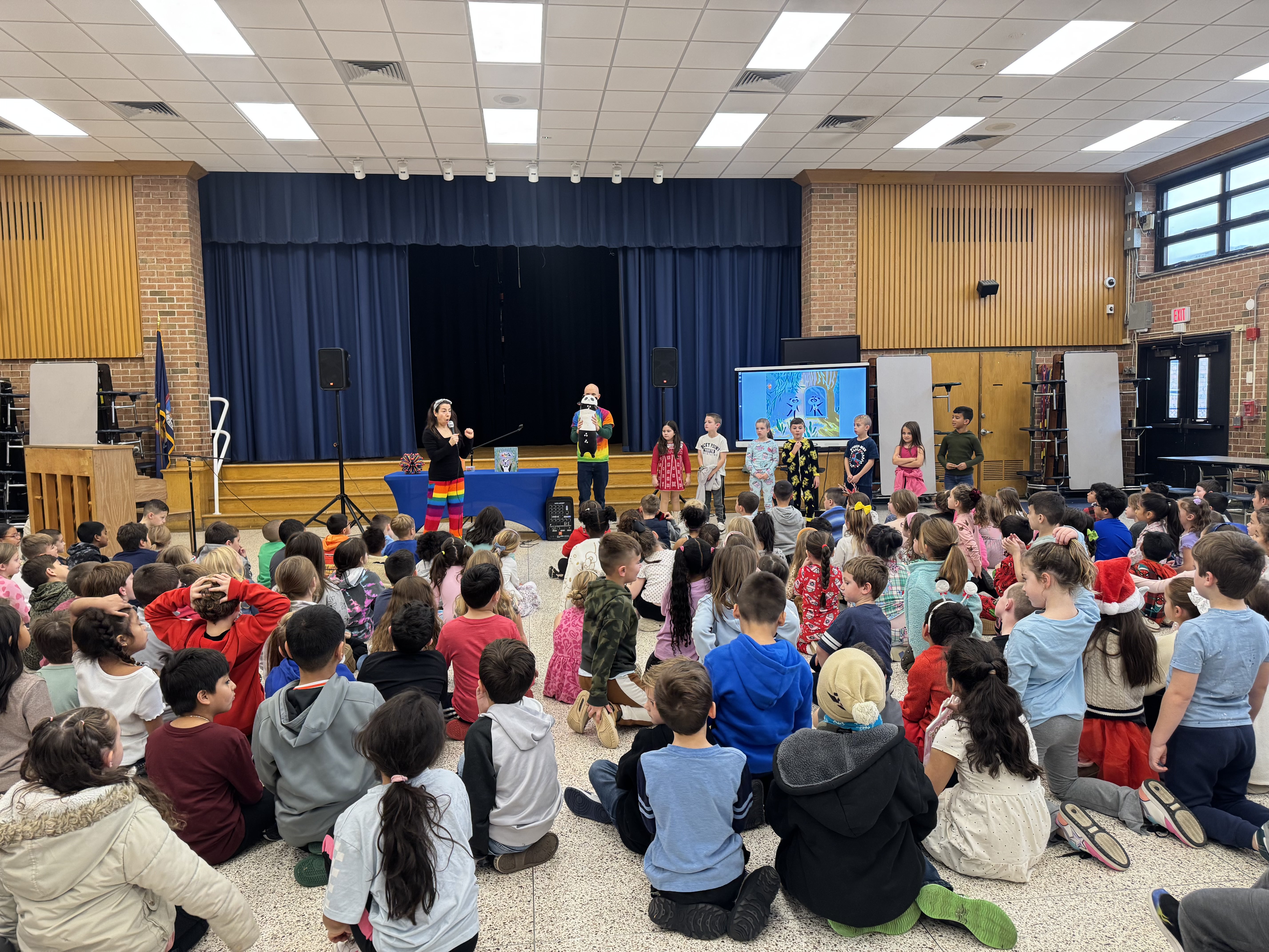 A child holding Rainbow Panda book