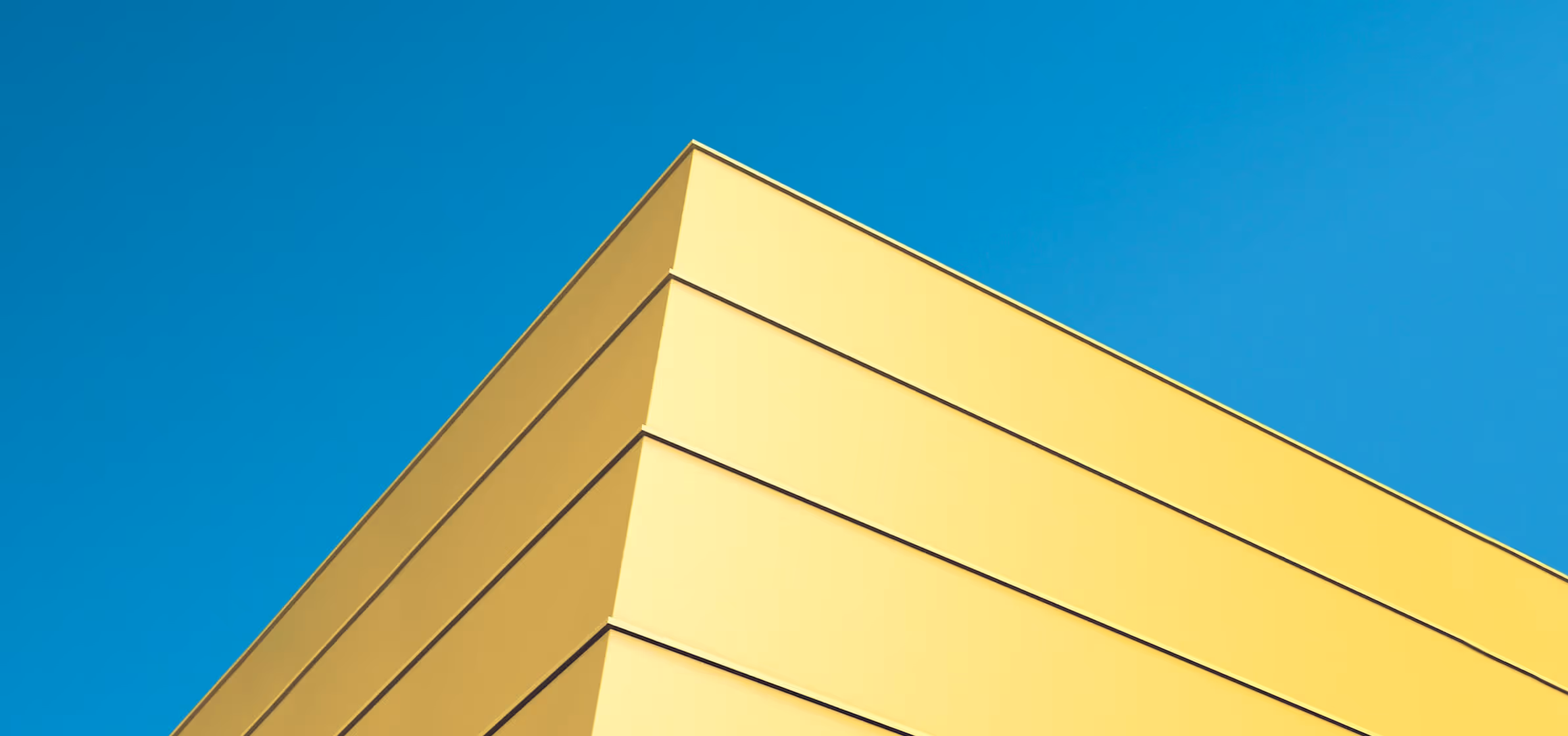 A yellow start-up garage against a blue sky