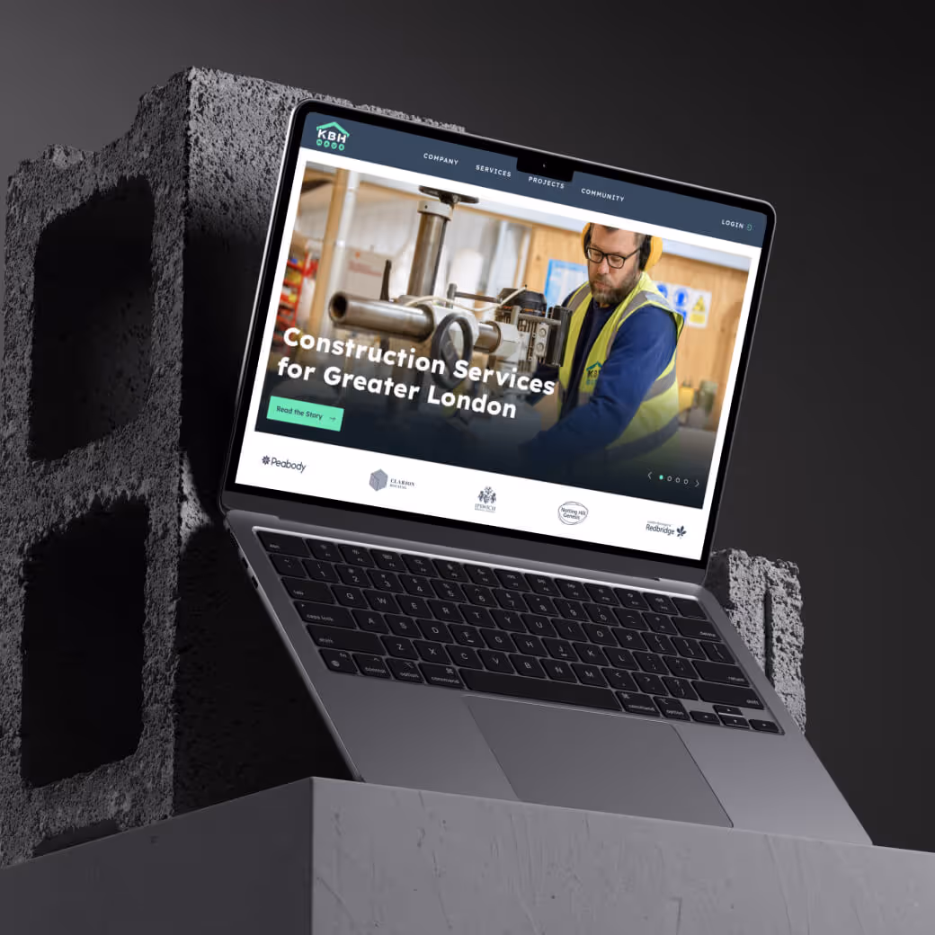 New KBH laptop homepage on a pedestal with bricks in the background