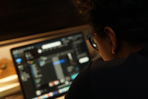 a man looking at a computer screen
