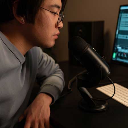 Person speaking on microphone