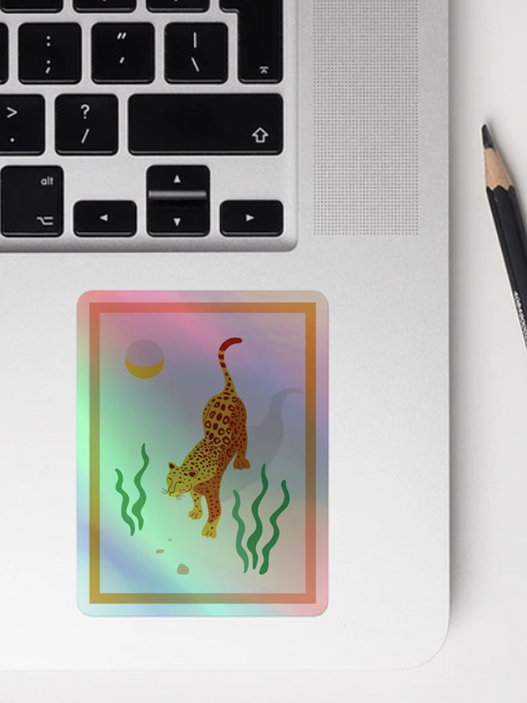 jaguar and moon illustration sticker at a laptop
