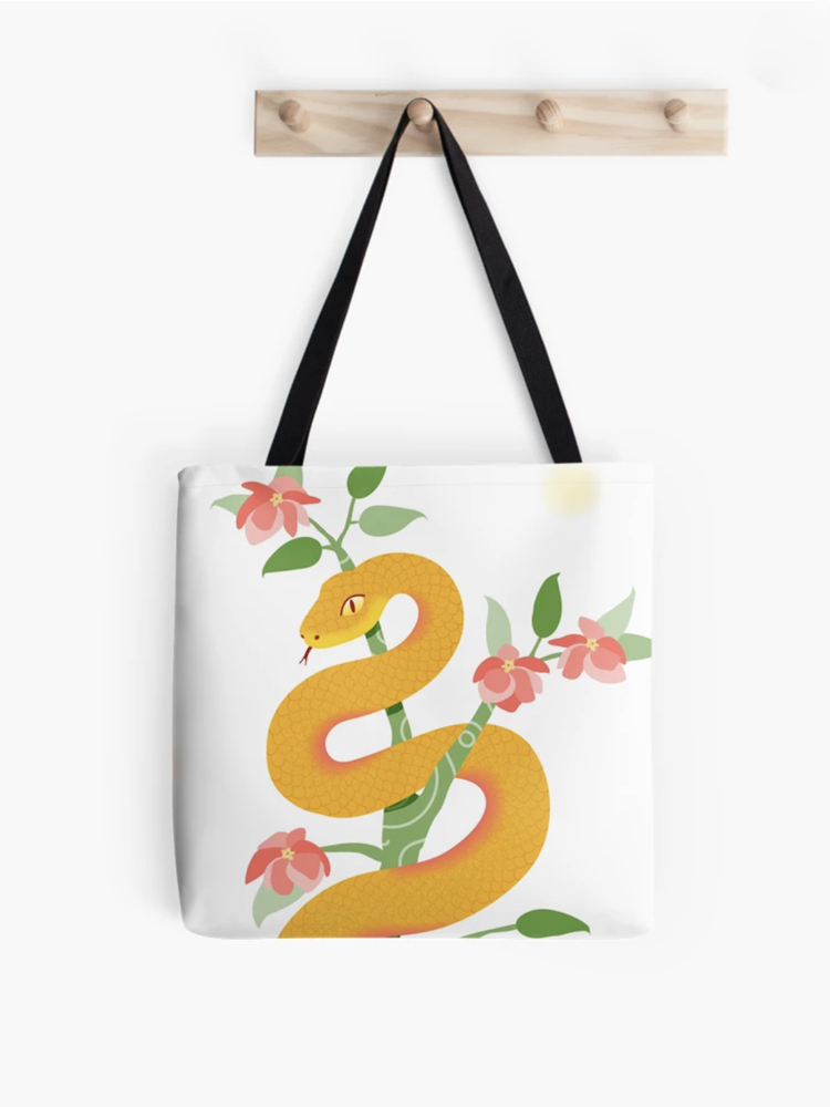 white bag with illustration of a snake in a tree with flowers