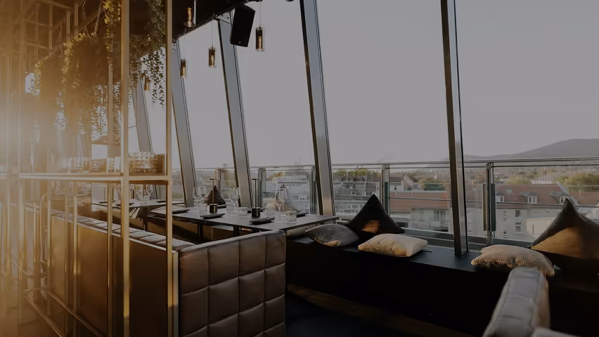 A restaurant with a view of the city.