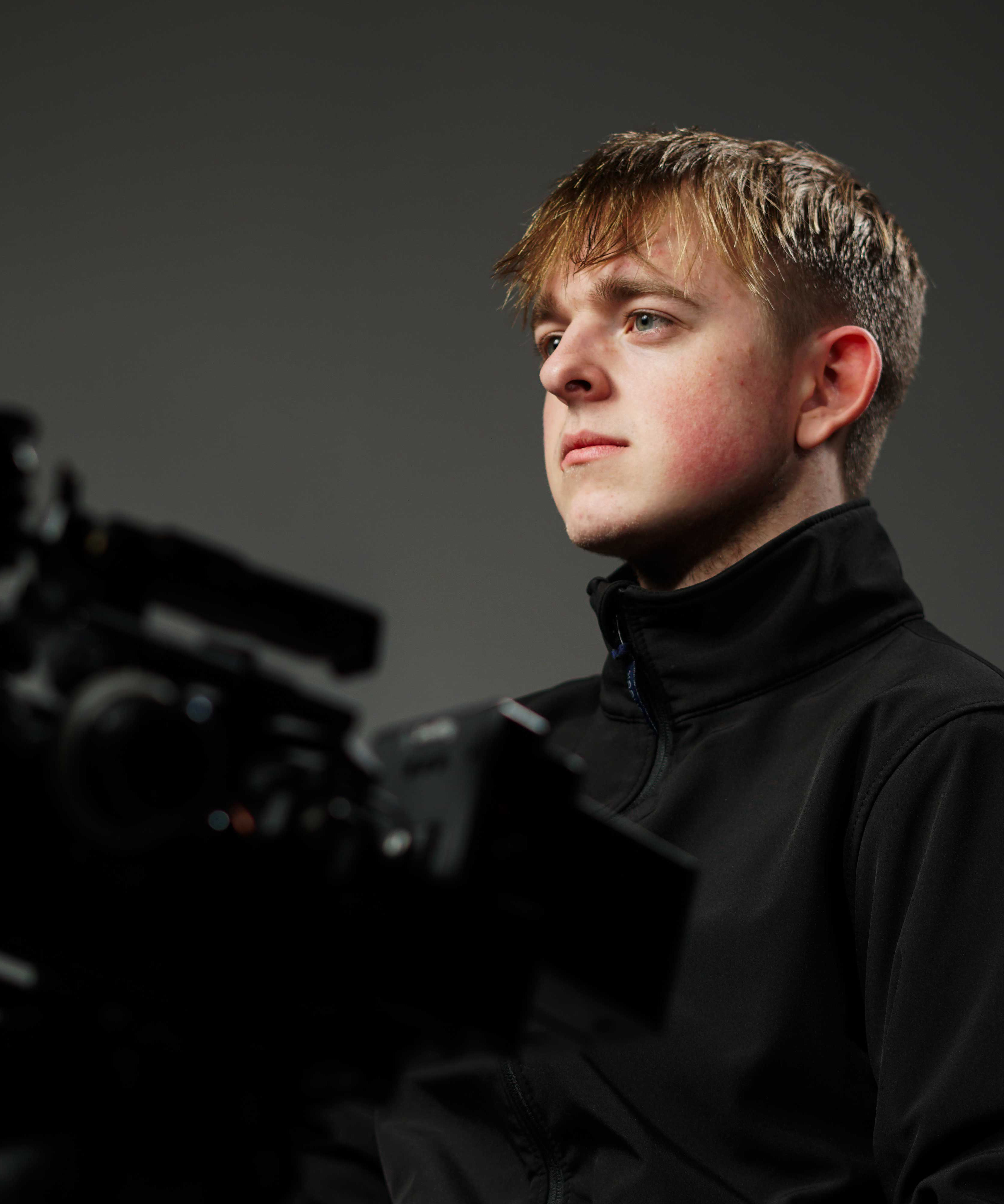Dan Wright holding camera gimbal in harness
