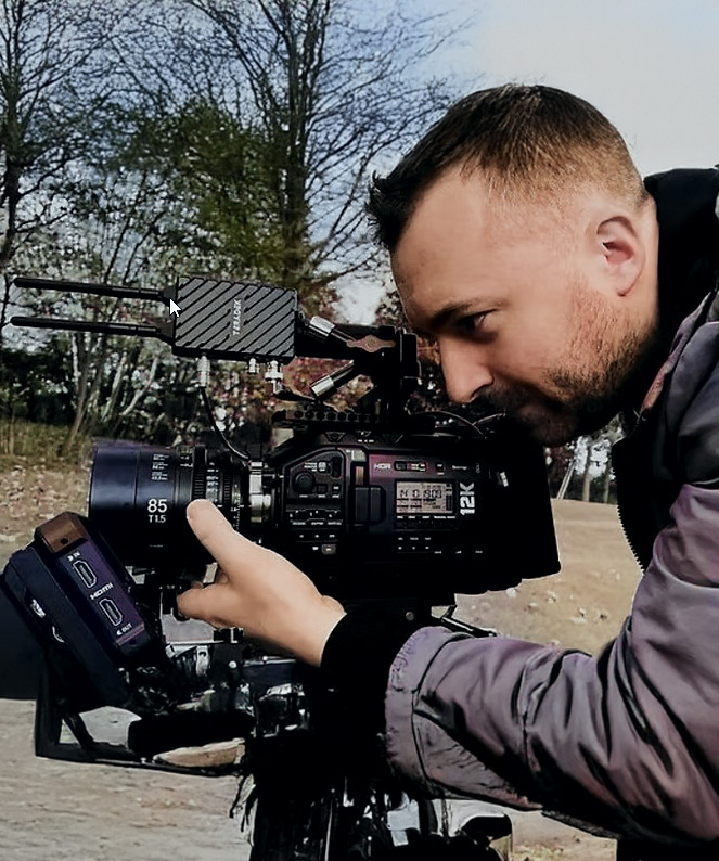 Dan Wright holding camera gimbal in harness