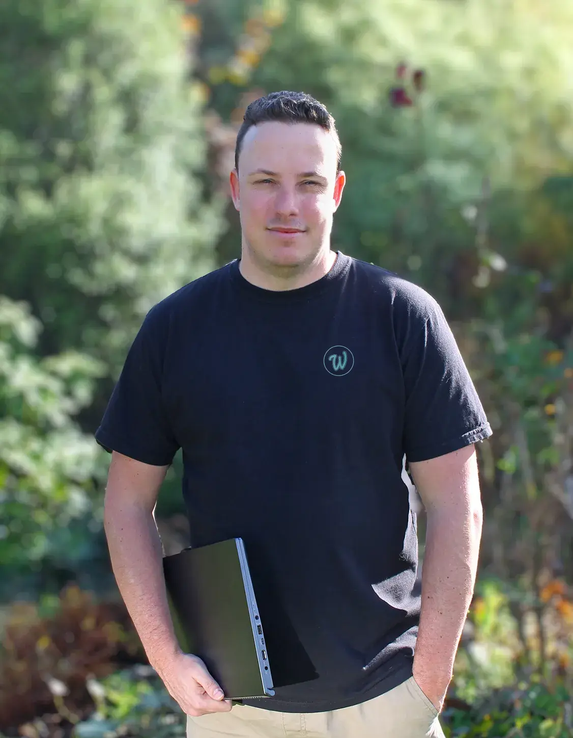 Andy Hoey Profile image holding laptop