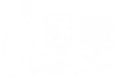 Person wearing headset working at desk with two monitors displaying maps and data.