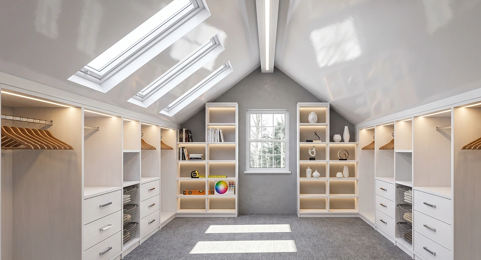 Finished attic closet with skylights, built-in shelving, drawers, and organized storage space.