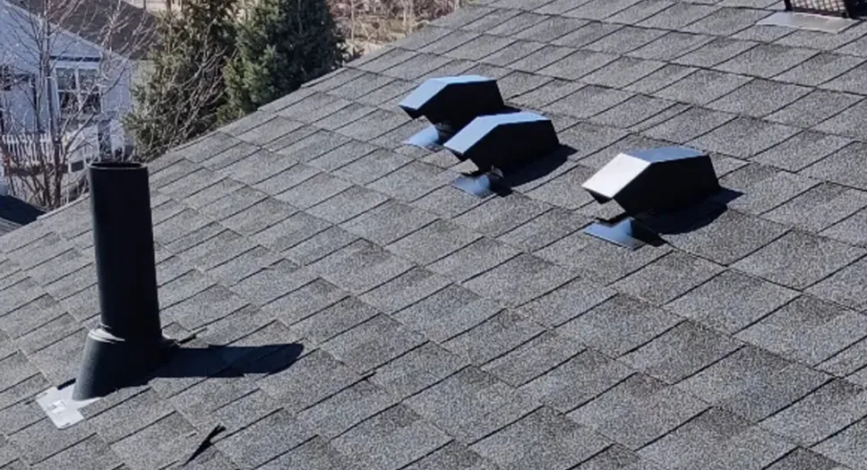 Roof vents installed on an asphalt shingle roof to support attic ventilation.
