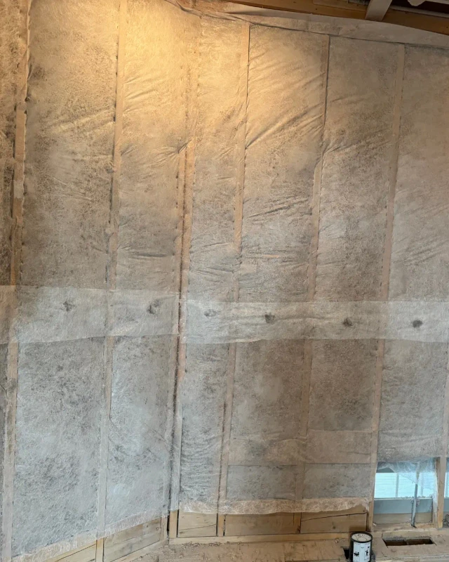Wall Insulation for Optimal Thermal Performance Insulation batts with vapor barrier installed in wall cavities for optimal thermal performance