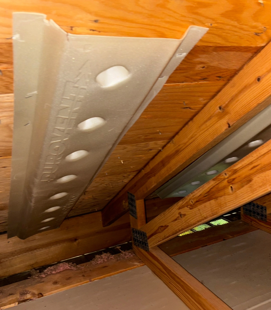 How to Install Soffit Vents on a Roof Green Attic Insulation crew installing soffit vents on a roof's eaves