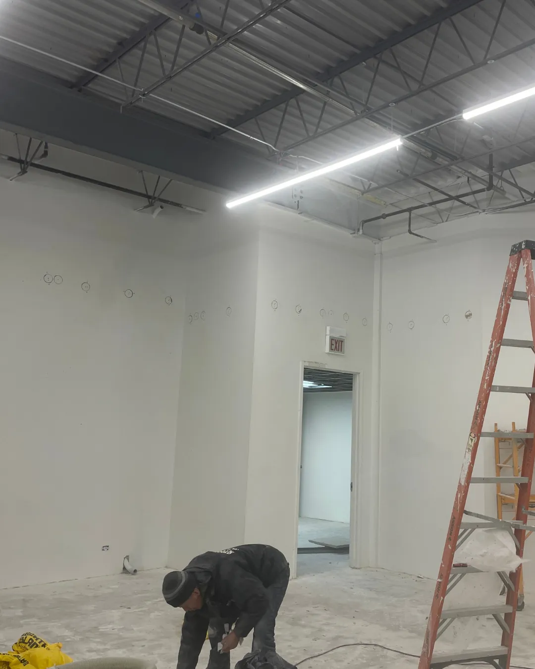 Insulation upgrades in an existing commercial building to meet retrofit energy code requirements.