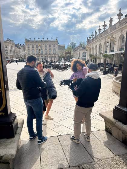 people filming in city location