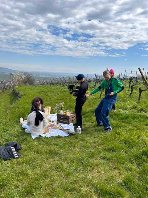 people filming in outdoor location