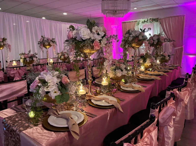 Enchanting light pink and purple decorations set the perfect ambiance for a magical wedding event.