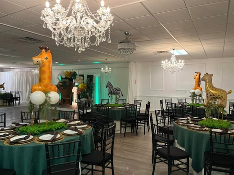The Palmyra Venue in New Jersey  1-year-old celebration. The venue is adorned with vibrant animal-themed balloons and a playful atmosphere.