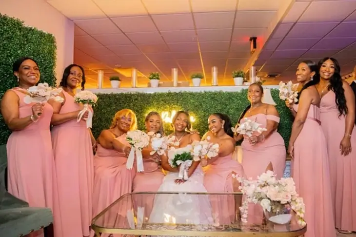 Elegant wedding reception decor at The Palmyra Venue in New Jersey, featuring tall vases with flower centerpieces in brown, beige, and gold tones