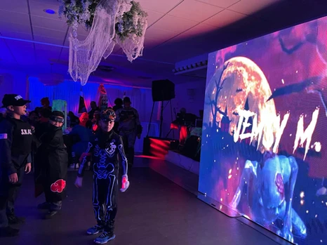 Kids wearing costumes in a scary-themed decorated venue at The Palmyra Venue, New Jersey.
