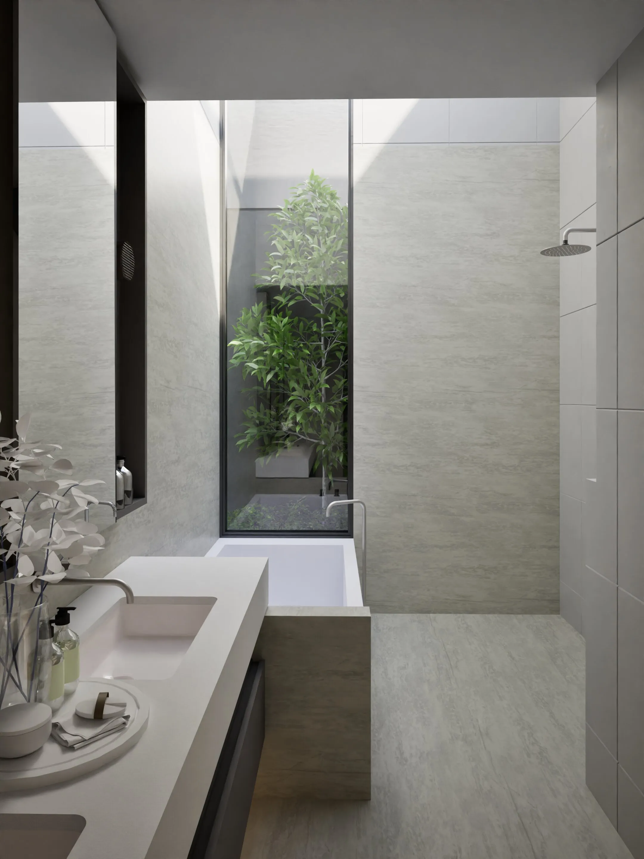 Minimalist bathroom with a white bathtub in front of a tall window showing green plants outside, a sink with countertop accessories, and a wall-mounted showerhead.