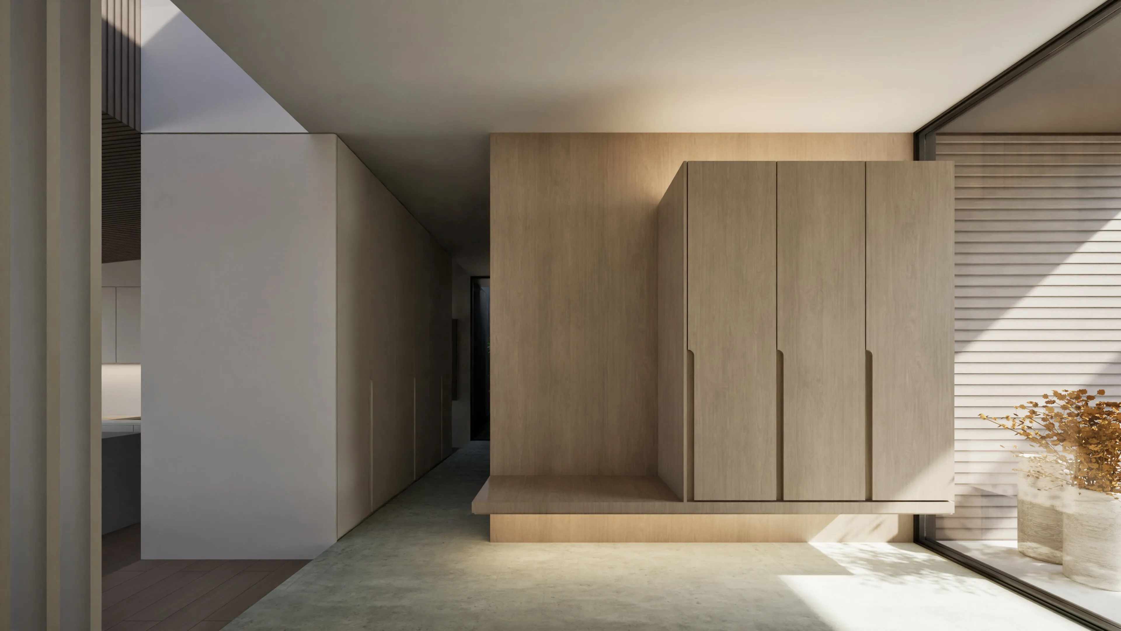Minimalist interior hallway with built-in wooden cabinets above a lit wooden bench, next to a large window with pots of dried plants.