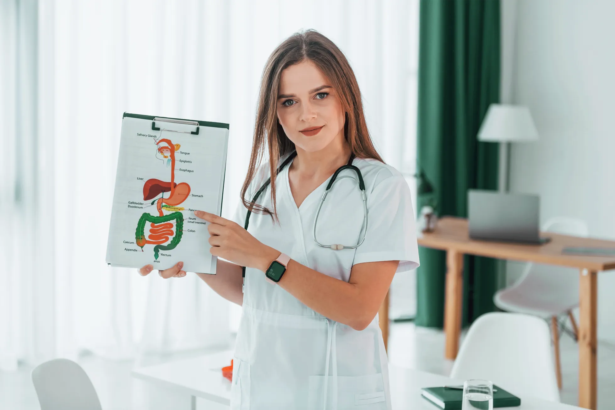 Gastroenterologist showing a photo of the digestive system