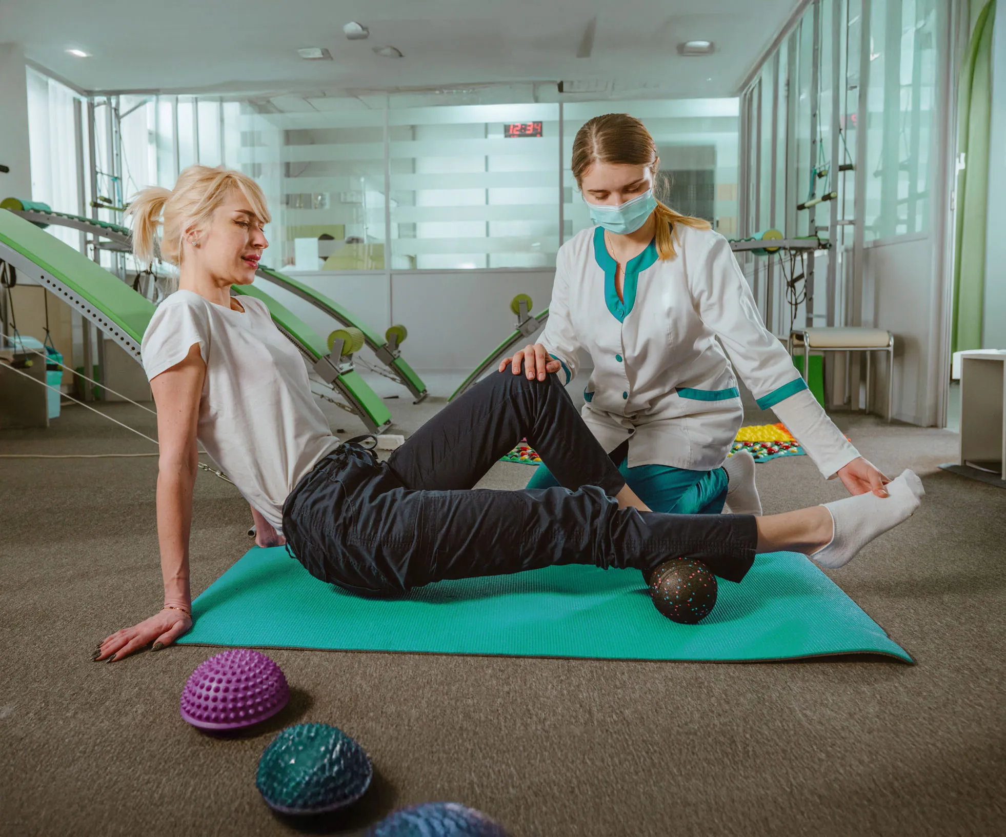 a physiotherapist working with a woman